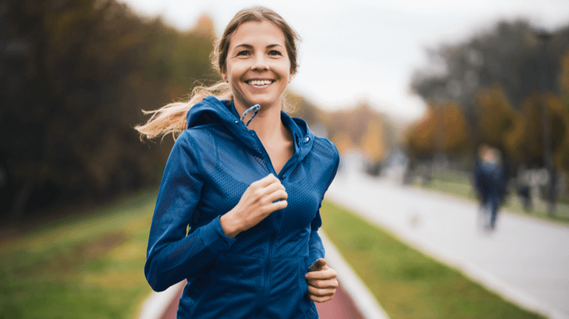 woman running with a smile